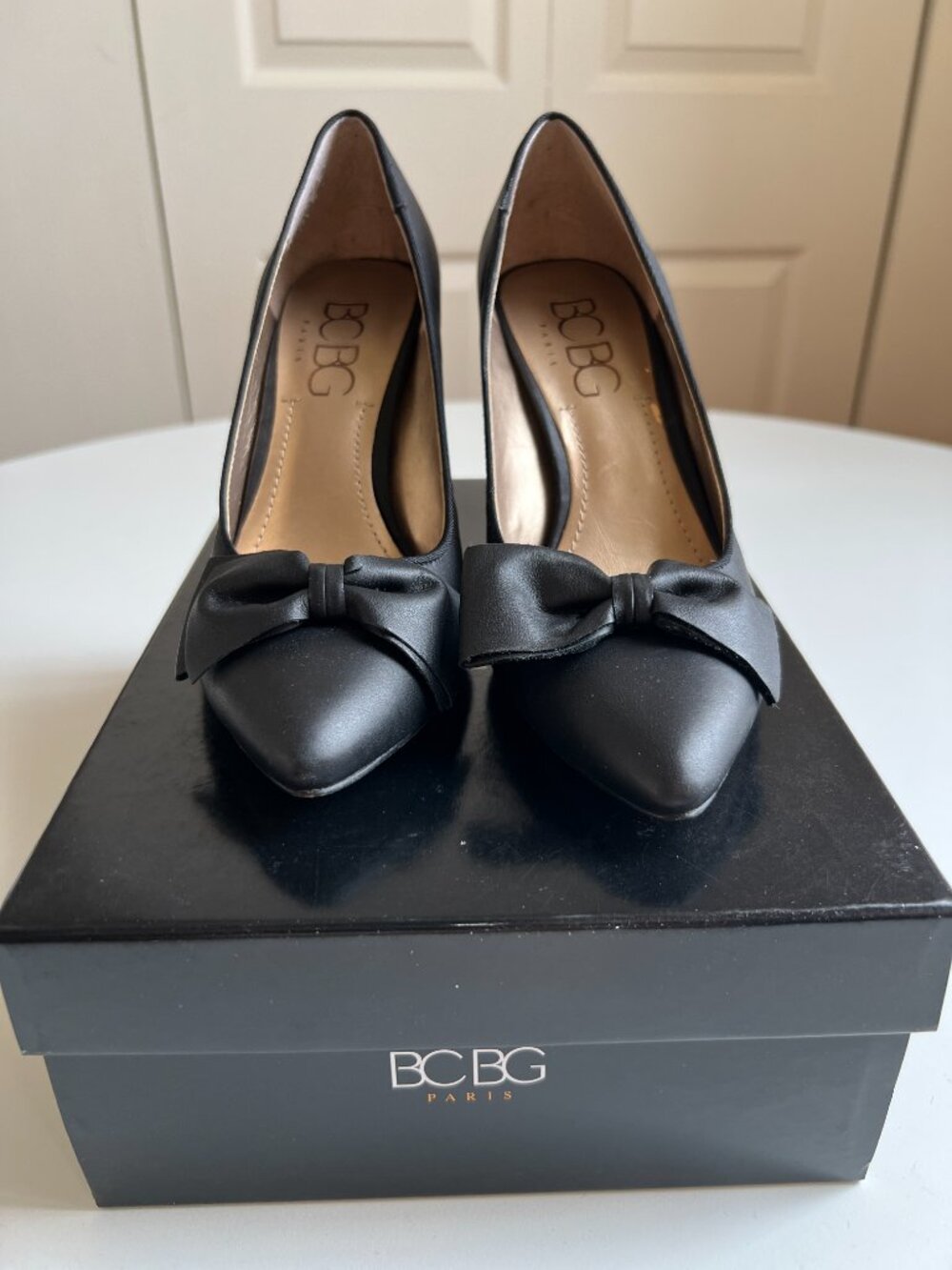 BCBG Dromka black leather pumps with bow. Sz 7, worn once, in box.